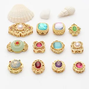 Selection of vintage gold-plated hollow charms with colorful gemstones for DIY jewelry