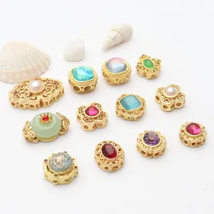 Assorted gold-plated hollow charms with vibrant gemstones for DIY jewelry crafts