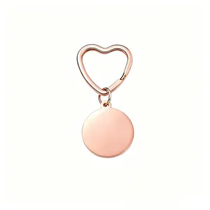Detailed view of a rose gold heart-shaped keychain with a blank round tag for engraving