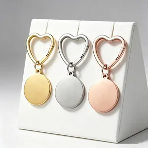 Set of heart-shaped stainless steel keychains with round engraving tags in three colors