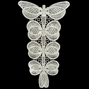Macro detail of white polyester embroidered lace butterfly pattern for clothing decoration