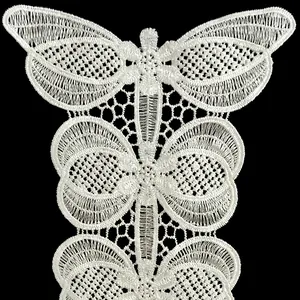 Detailed macro view of high quality white embroidered lace butterfly pattern patch decoration
