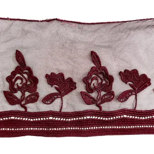 Detailed macro view of wine red floral embroidered mesh lace trim for DIY garment accessories