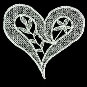 Detail of white fish silk embroidered heart lace patch with leaf and floral motifs