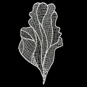 Detailed view of a white hollow-out lace embroidery patch in a butterfly-like design