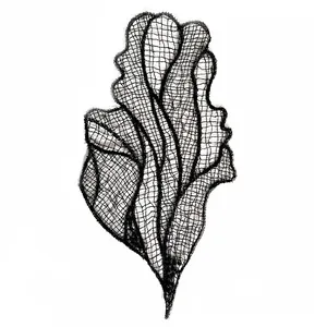 Close-up detail of black embroidered lace mesh patch with delicate floral patterns for DIY