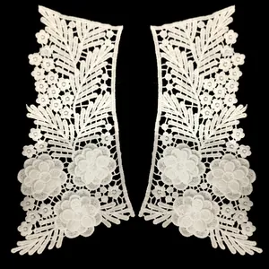 Detailed macro view of symmetrical white milk silk floral lace embroidered patches for collars