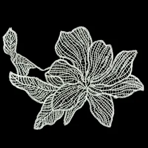 Detailed view of white hollow lace embroidery flower patch for DIY clothing sewing