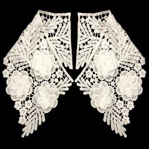 Detailed view of white milk silk embroidered lace faux collar with symmetrical floral patterns