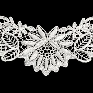 Detailed macro view of white floral embroidered lace trim for DIY sewing and crafting