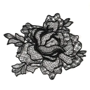 Close-up detail of delicate black rose floral lace applique with intricate mesh design
