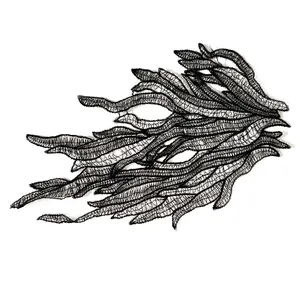 Detailed macro view showing the intricate texture of the black embroidery lace patch