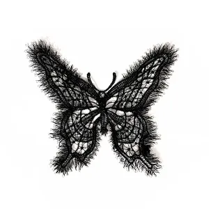 Macro view showing a black embroidered butterfly lace patch with delicate eyelash fringe