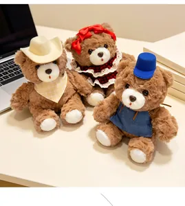Three plush teddy bears in cute outfits and hats displayed on a desktop