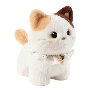 Adorable white calico cat plush doll wearing a delicate white lace collar and charms