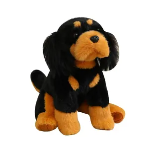 Realistic black and tan plush dog toy sitting on white background for home decor.