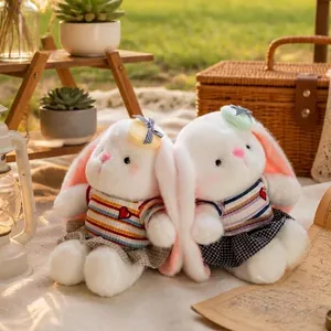 Pair of cute plush long-eared Dudu rabbits in striped outfits for gifts