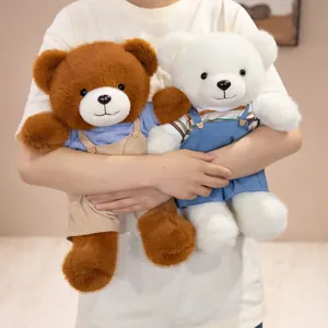 Pair of cute plush teddy bears wearing overalls, ideal for romantic and festive gifts.