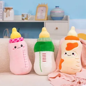 Set of cute baby bottle plush pillows in pink, green, and orange for kids
