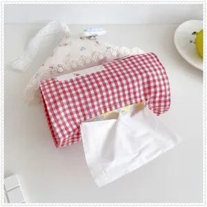 Close-up of red checkered house-shaped fabric tissue box cover with lace detail