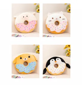 Detailed view of four cute animal donut plush cushions: sheep, cat, dog, and penguin character designs.