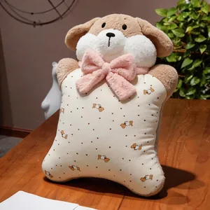 Close-up of a cute plush puppy pillow featuring a pink fluffy bow and dog pattern