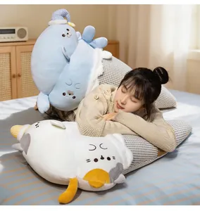Cozy lifestyle scene showing a girl resting on cute seal and cat plush cushions on a bed.