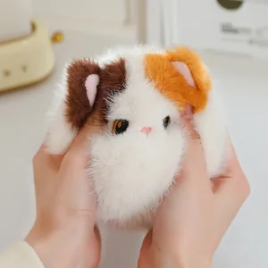 Adorable soft calico cat plush squishy toy for stress relief and desk decoration.