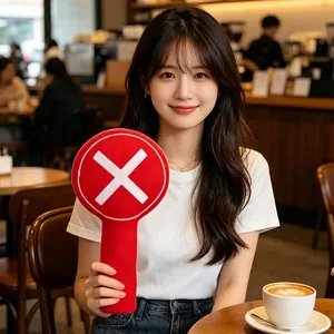 Red handheld plush indicator paddle with X sign for photography and video props