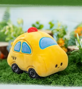 Soft yellow cartoon taxi car plush toy featuring cute embroidered face and taxi light