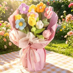 Bouquet colorato di tulipani e girasoli di peluche in una confezione regalo rosa