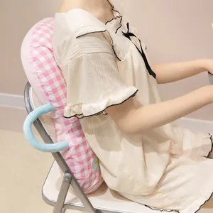 Ergonomic pink checkered lumbar support pillow for office chairs and dorm rooms.