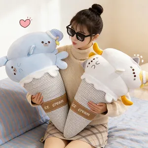 Cute seal and cat ice cream cone plush pillows in blue and white held by a model