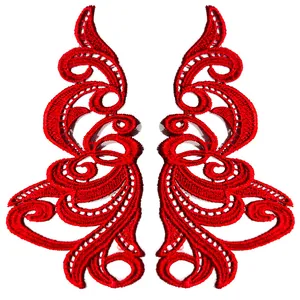 Detail view of red symmetrical water-soluble embroidered lace patches for DIY crafts