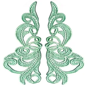 Detailed macro view of mint green water-soluble symmetrical lace embroidery patches