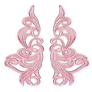 Detailed macro view of pink water-soluble embroidery lace floral patches for DIY sewing
