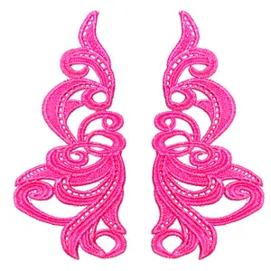 Macro view of symmetrical pink lace embroidery patches with intricate hollow design