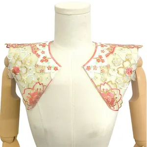 Detail view of colorful embroidered floral cloud shoulder fake collar on a mannequin torso