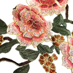 Close-up of vibrant pink floral embroidery lace patch for DIY clothing decoration