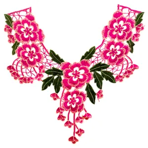 Detailed view of pink floral embroidered lace collar patch with green leaves