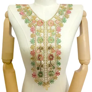 Detailed gold thread embroidered lace collar with colorful sequins on mannequin.