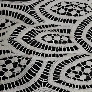 Detailed close-up showing the intricate hollow embroidery of white water-soluble lace