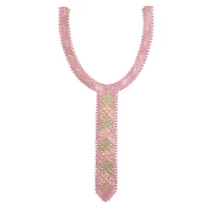 Close-up detail of a pink embroidered lace collar featuring intricate green floral patterns