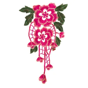 Detail of magenta floral embroidery lace patch with ethnic hollow design