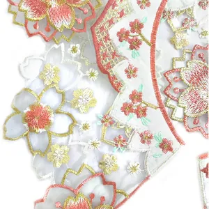 Intricate colorful cherry blossom embroidery detail on white organza Hanfu collar