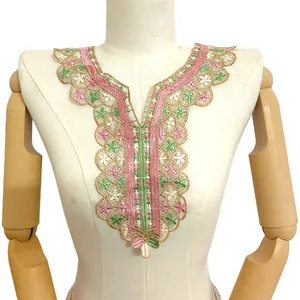 Close-up of intricate colorful hollow lace embroidery detail on a false collar applique.
