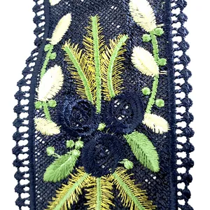 Detailed close-up showing heavy floral embroidery on dark blue lace collar patch