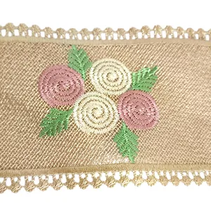 Close-up detail showing intricate floral embroidery on a golden mesh lace collar trim