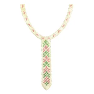 Detail of colorful heavy embroidered lace collar with pink and green cross-stitch geometric patterns