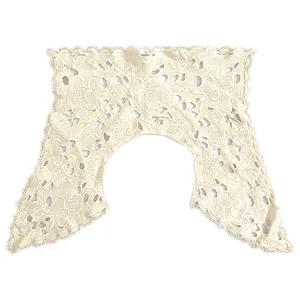Detailed macro view of the intricate hollow cotton embroidered lace collar pattern